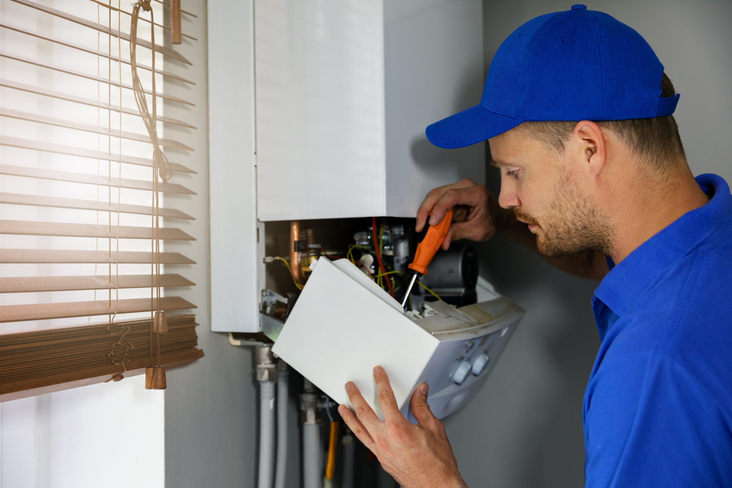 man fixing boiler