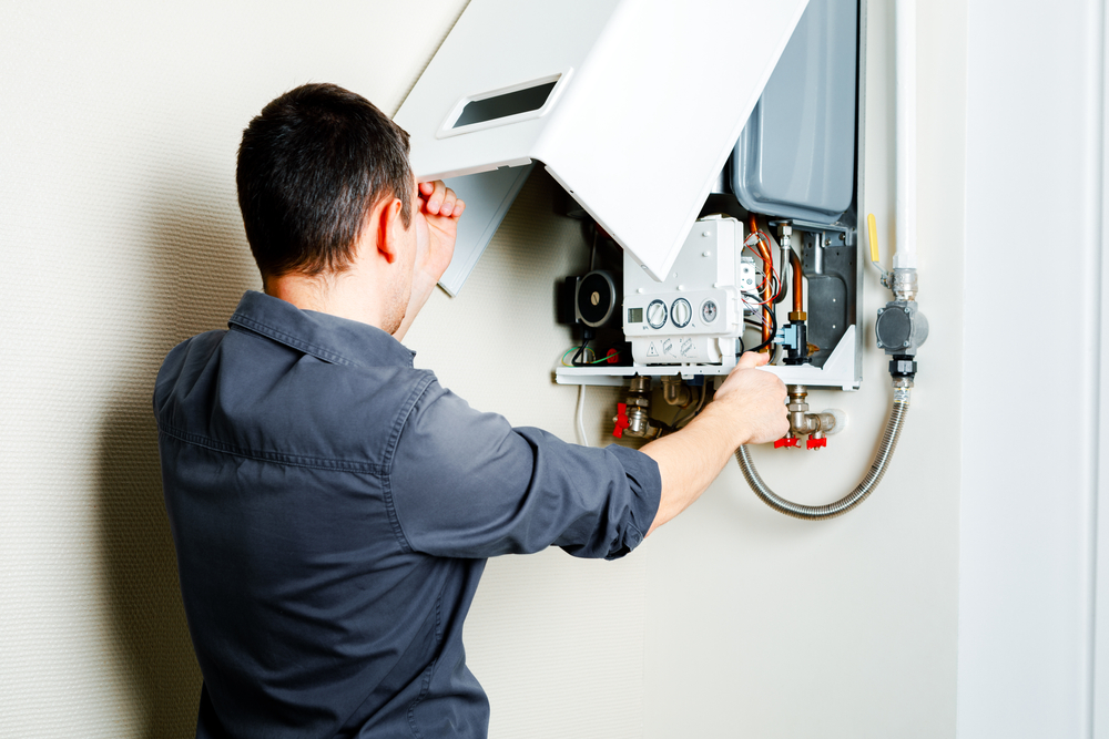 engineer fixing a boiler
